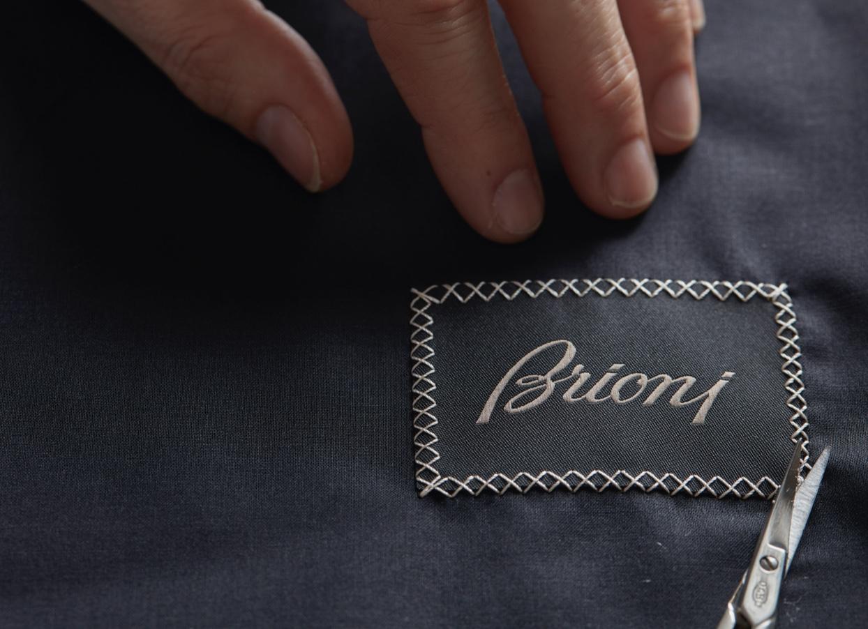 The iconic Brioni label is hand stitched on a garment