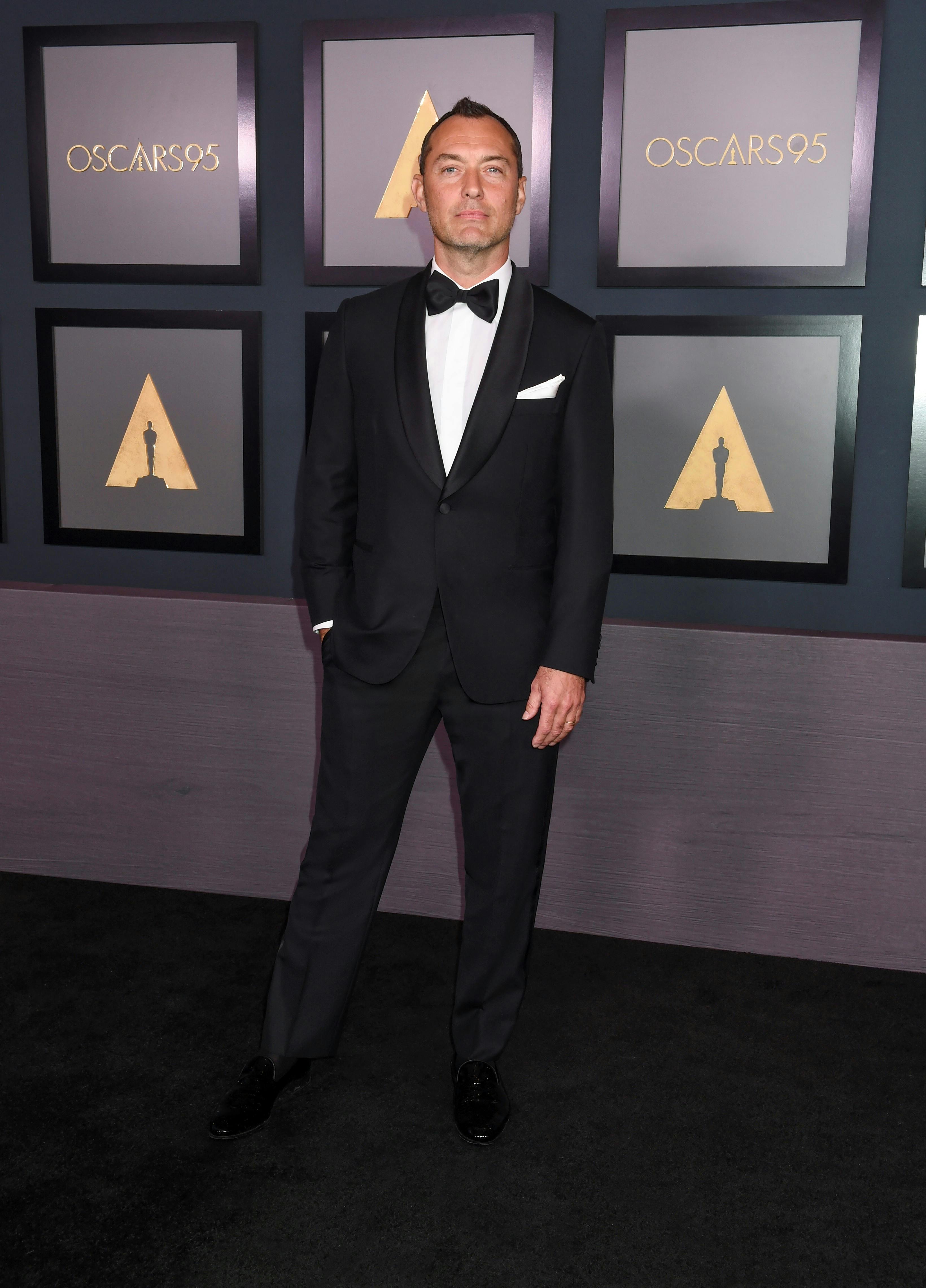 Jude Law wearing a Brioni black tuxedo