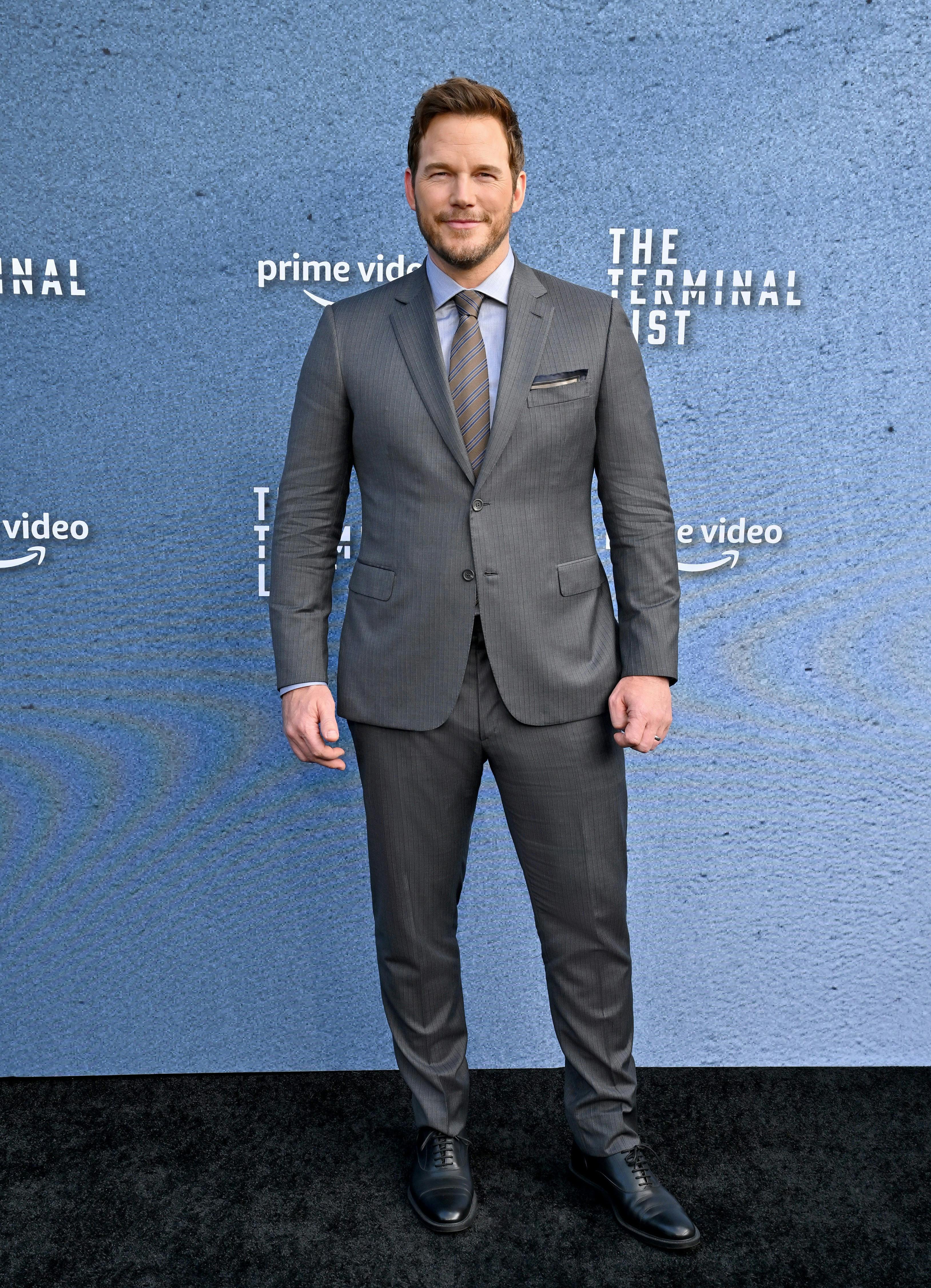 Chris Pratt wearing a Brioni grey suit