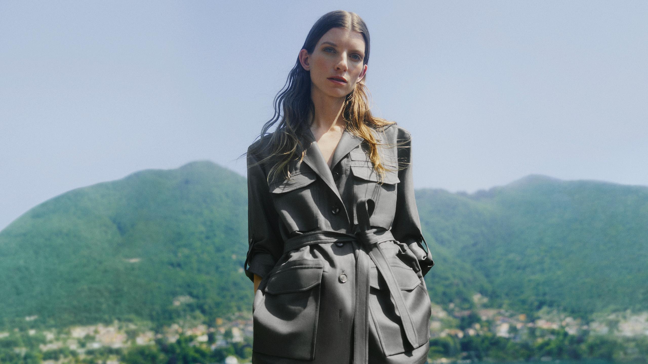 Woman model wearing a black suit from Brioni capsule collection 