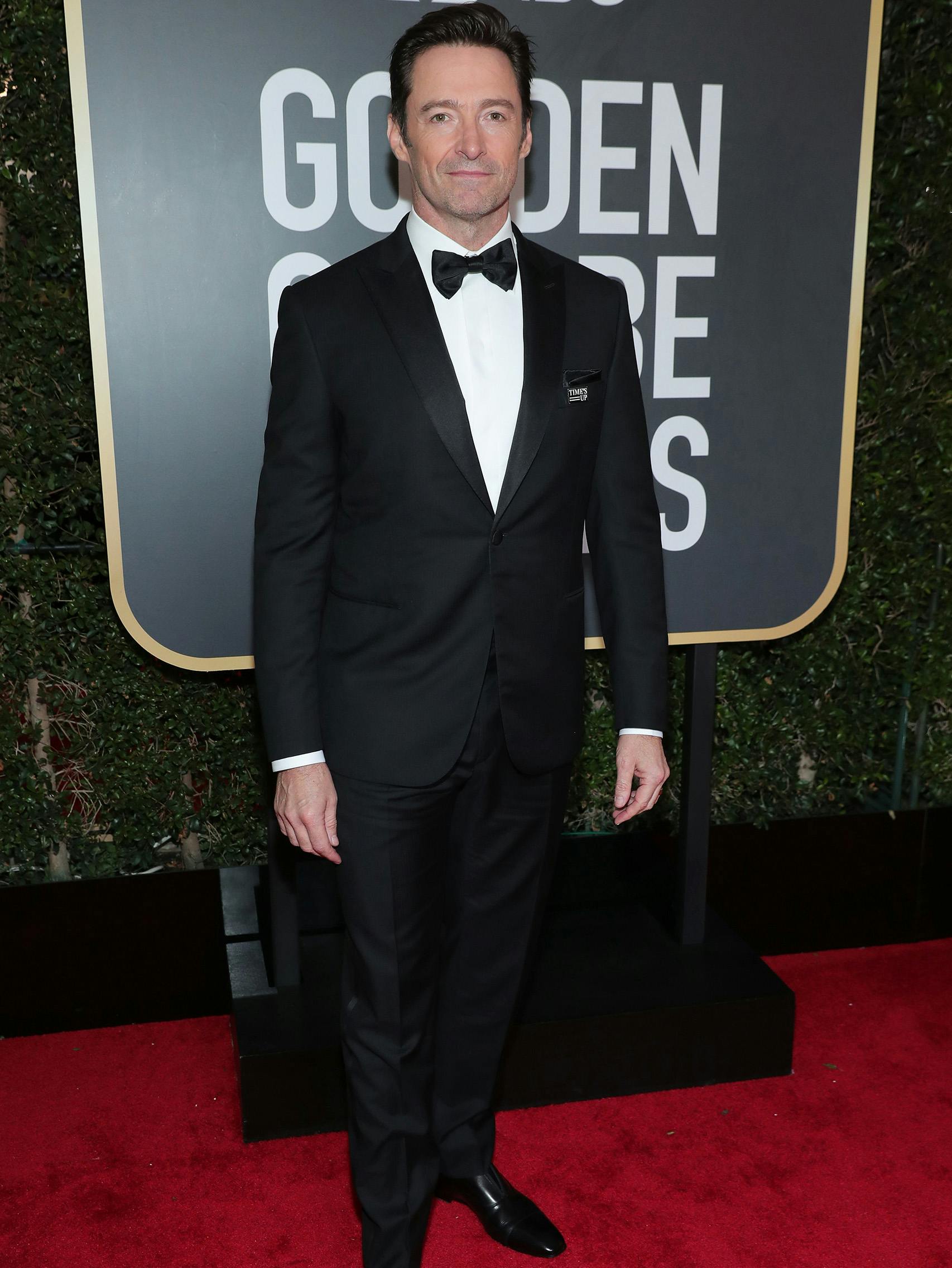 Hugh Jackman wearing a Brioni bespoke black tuxedo