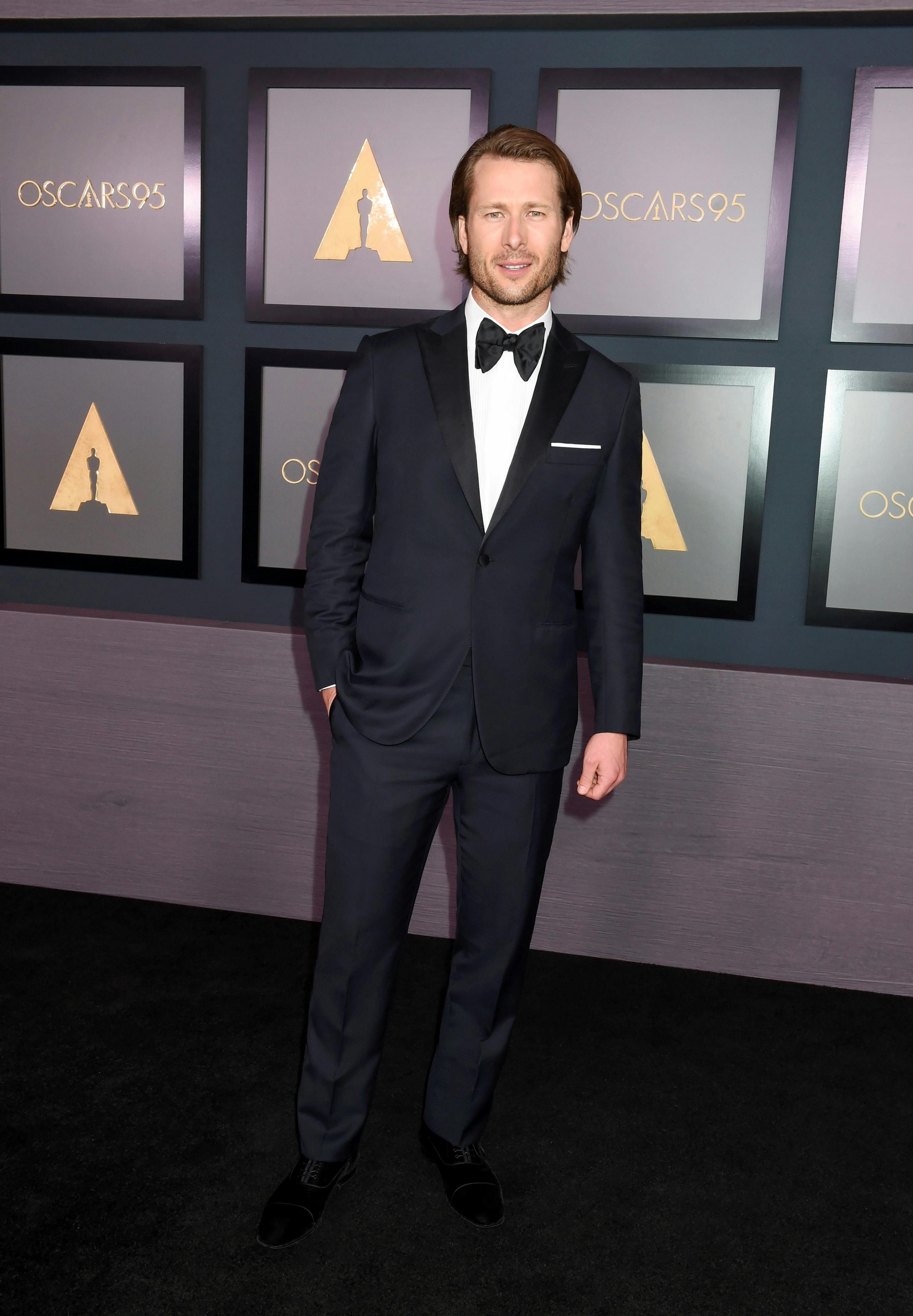 Glen Powell wearing a Brioni blue tuxedo