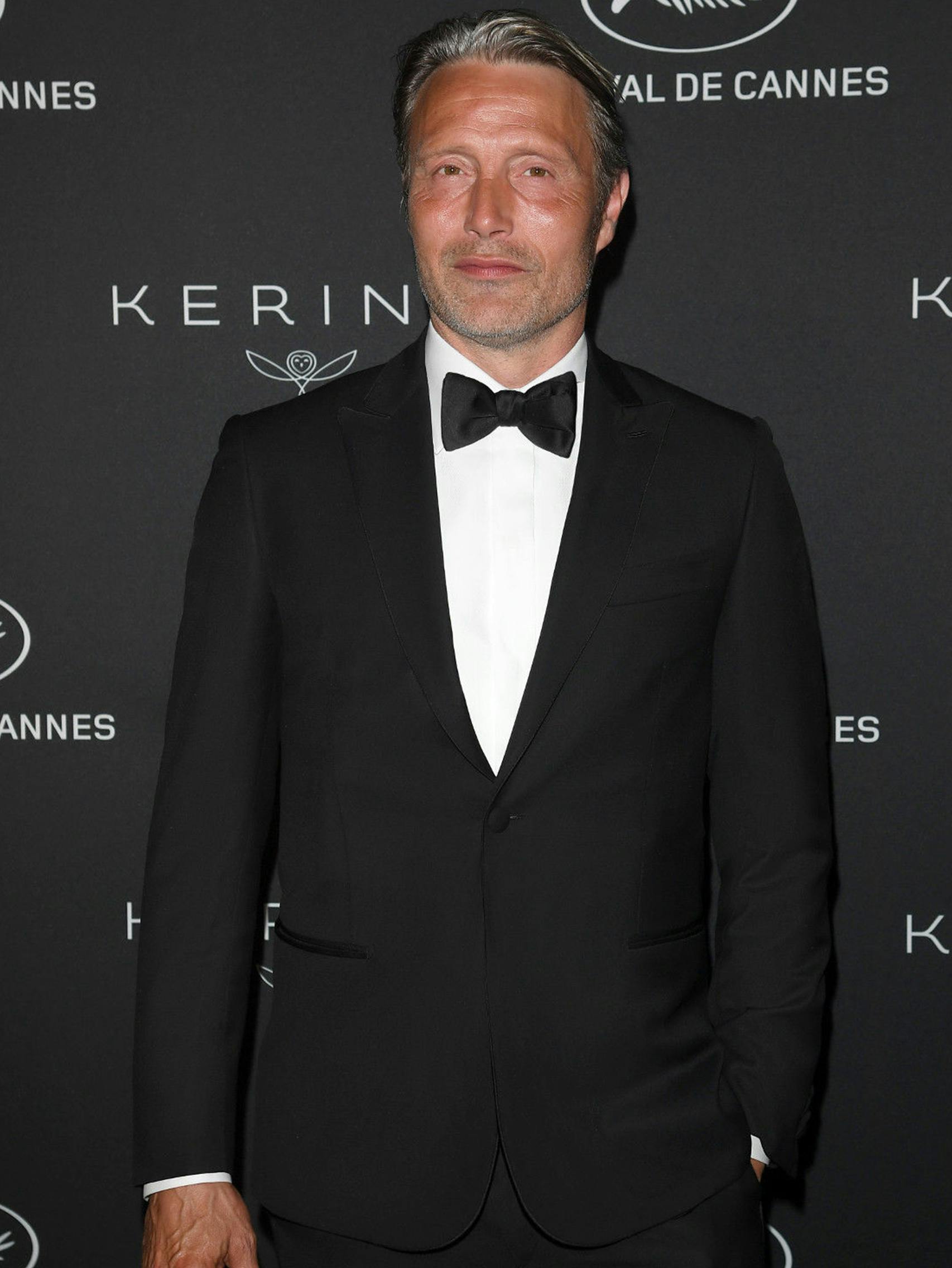 Mads Mikkelsen wearing a Brioni bespoke black tuxedo