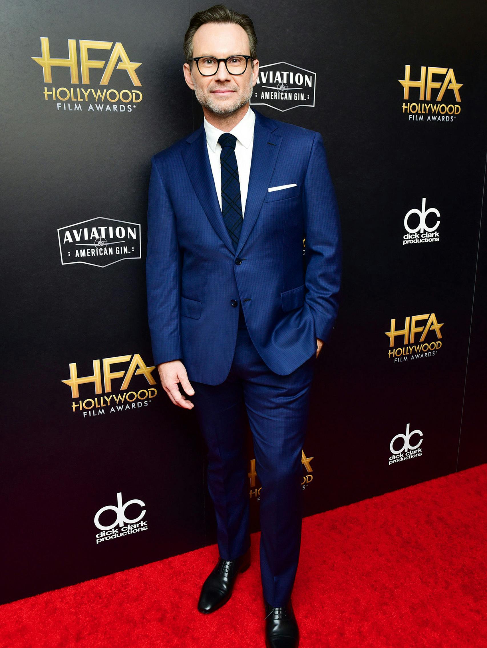 Christian Slater wearing a Brioni bespoke blue suit