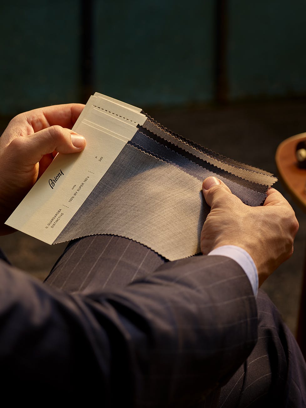 A Brioni master tailor shows a selection of Bespoke fabrics